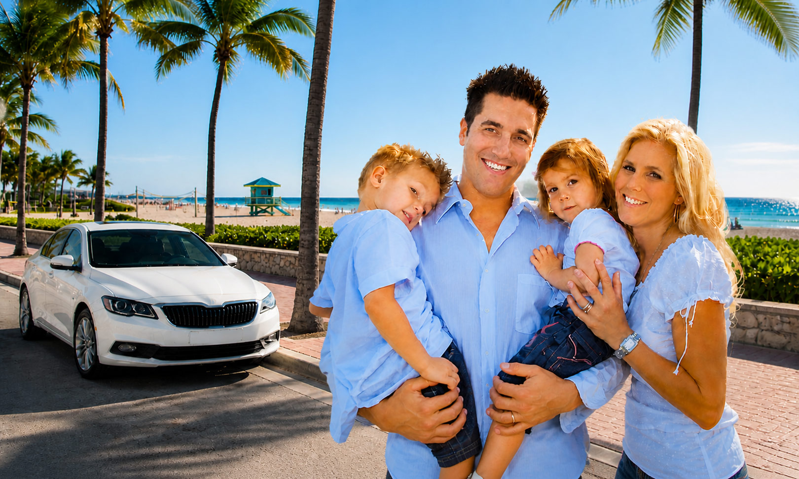 Happy family with car near Miami Beach palm trees and ocean